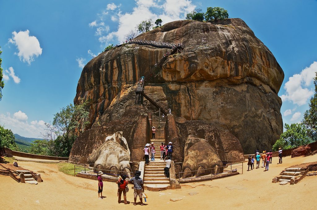 Sigiriya, Sri Lanka - May 20, 2011: Unidentified tourists climb Sigiriya Lion rock fortress in Sigiriya, Sri Lanka. Sigiriya is listed as UNESCO World Heritage Site.